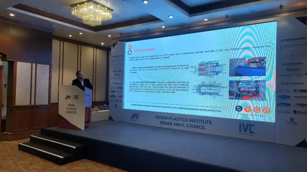 Speaker presenting on heating process at conference