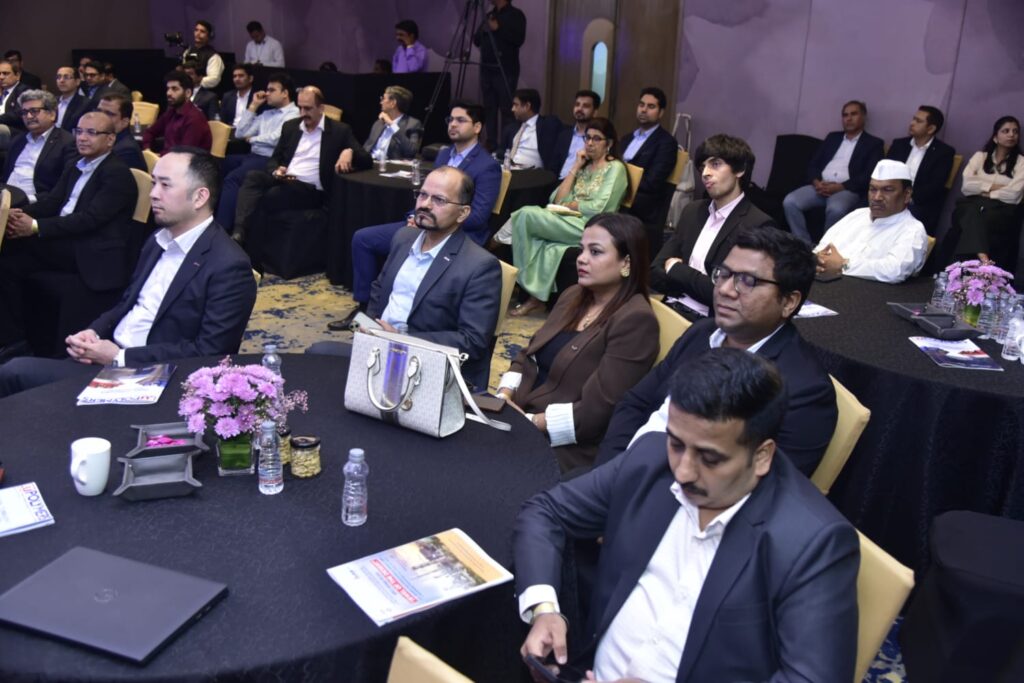 Attendees listen during a formal business conference session.