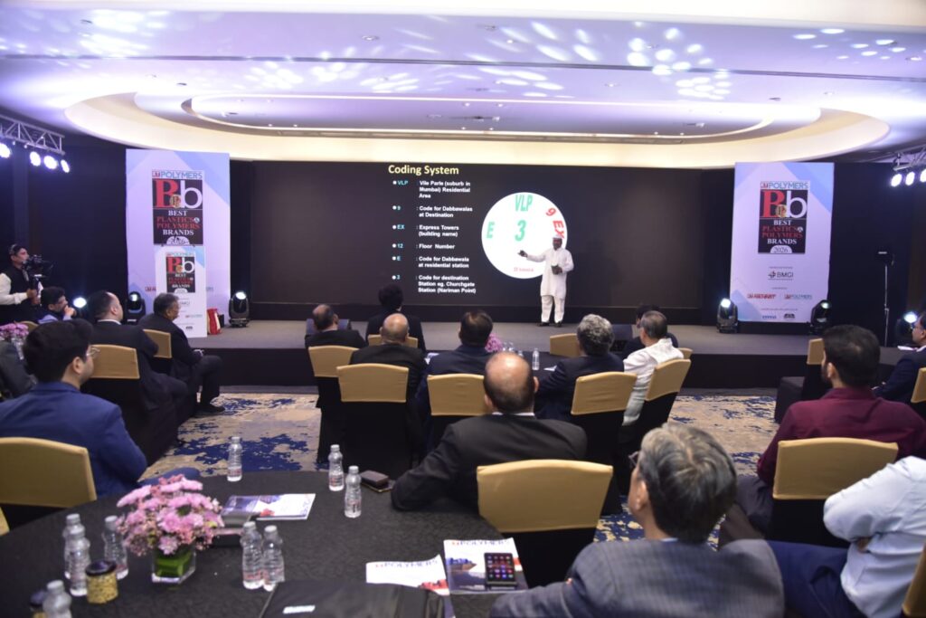 Presenter addresses audience at Best Plastics and Polymers Brands event