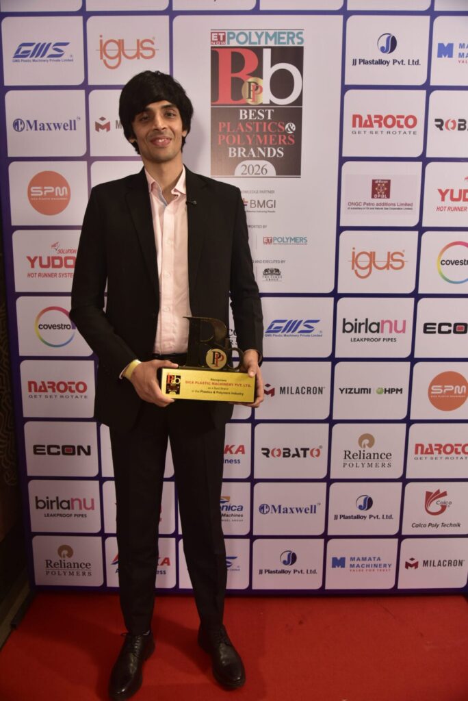 Man holding Best Plastics and Polymers Brands award