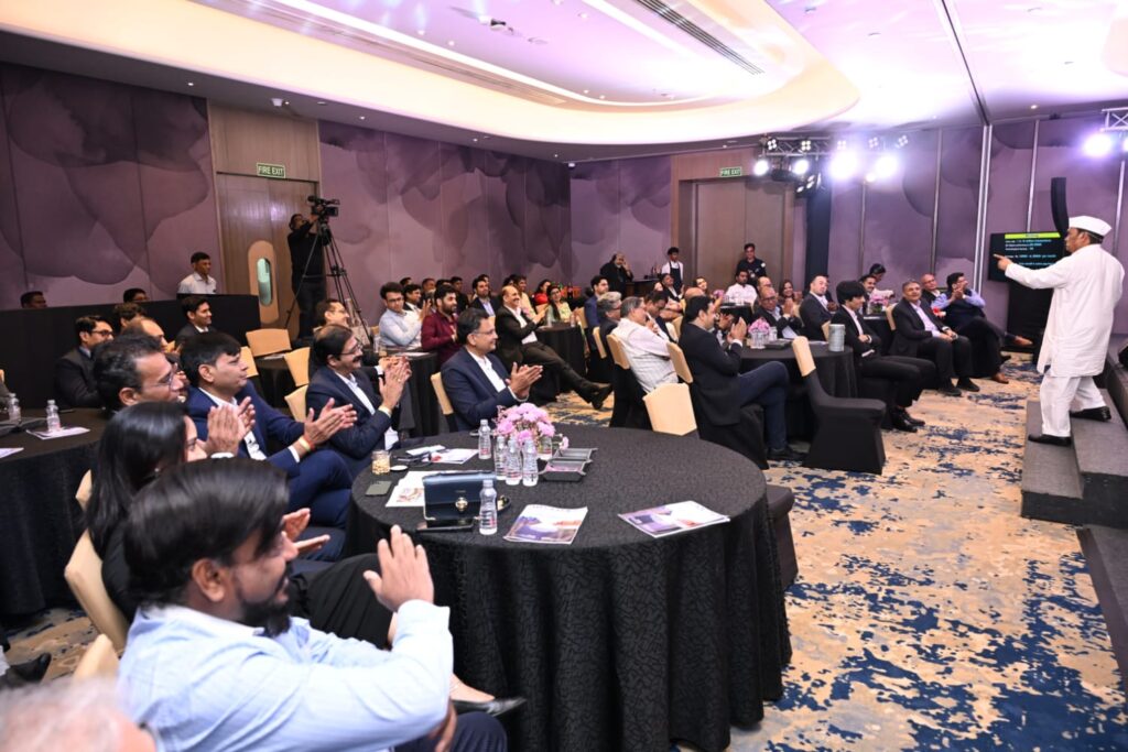 Audience applauds speaker at a hotel conference