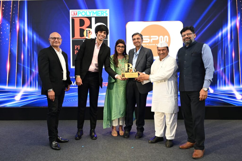 Six attendees present award at polymer industry ceremony