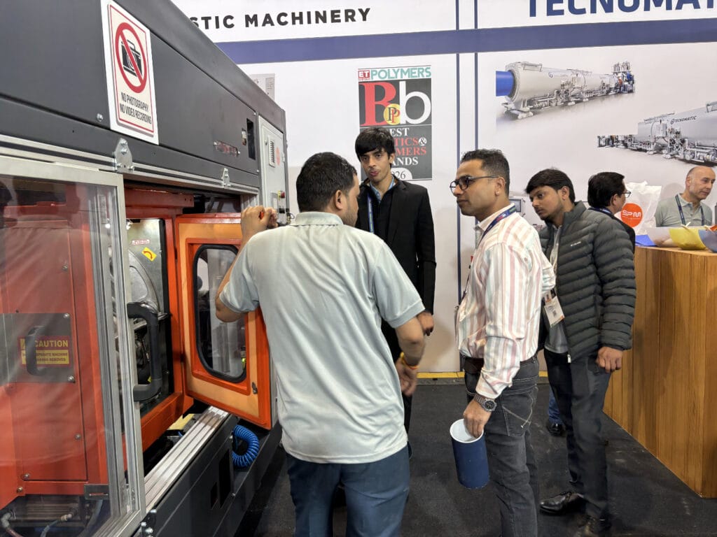 Trade show demo of industrial plastic molding machine