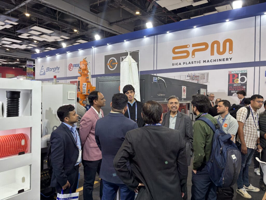 Visitors at SPM plastic machinery trade show booth