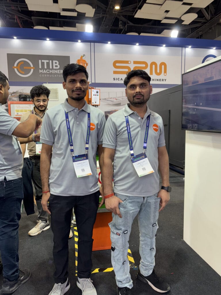 Two men at machinery trade show booth