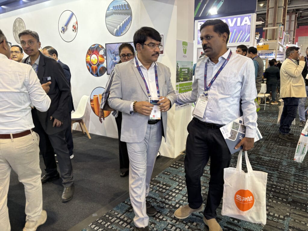 Business professionals talking at trade show booth