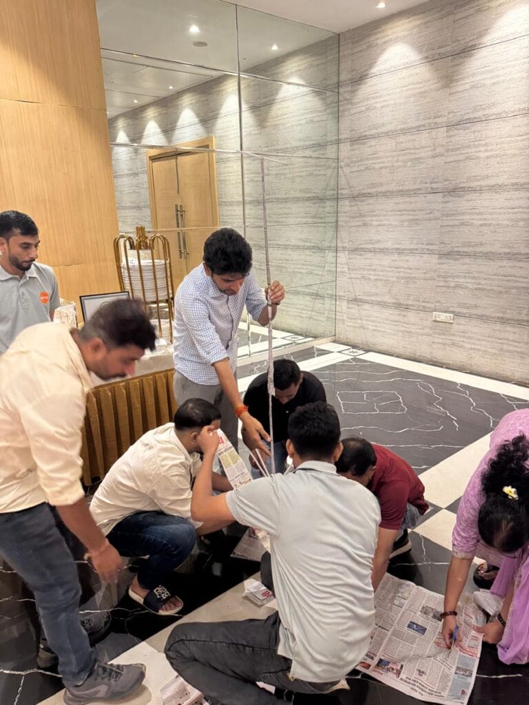 Group measuring and assembling item on marble floor