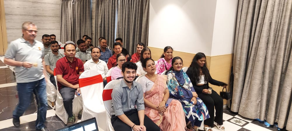 Attendees seated at an indoor meeting or presentation