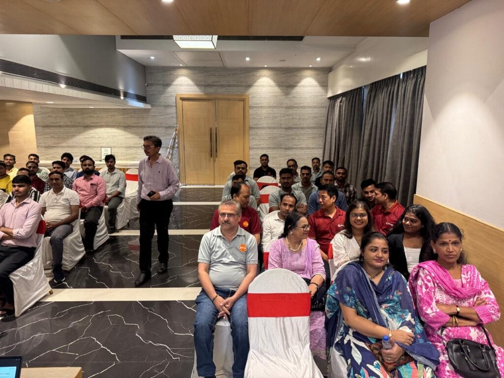 Attendees seated in a conference room before an event