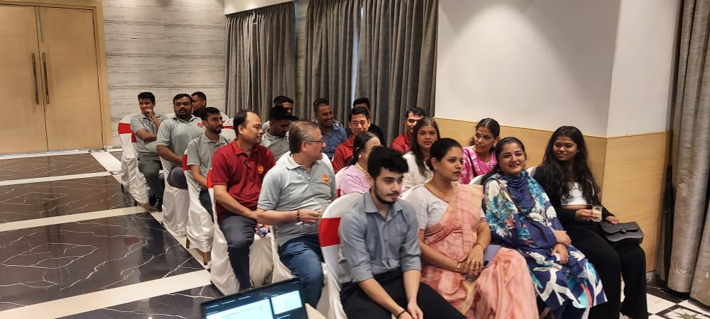 Attendees seated in a conference room before an event