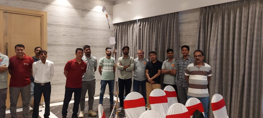 Group of men standing in a conference room