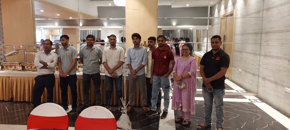 Group of restaurant staff standing at indoor event