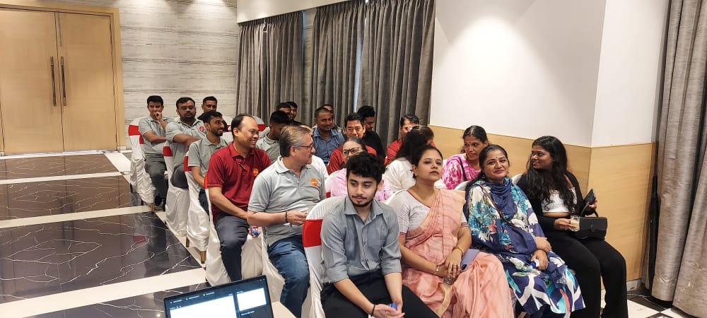 Attendees seated at an indoor event venue
