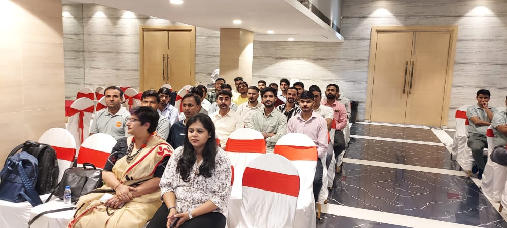 Attendees seated at an indoor conference or training session
