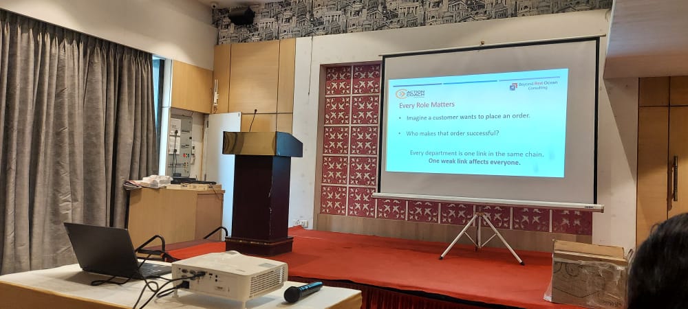 Conference room presentation screen with podium and projector